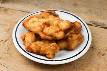 Delicious Fried Banana Fritters on Rustic Wooden Table