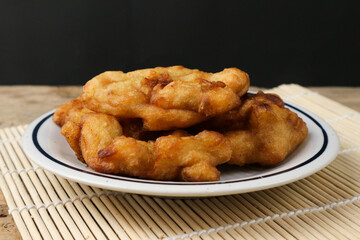 Delicious Golden-Brown Fried Banana Fritters on a Plate