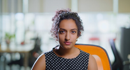 Indian happy young adult gen z expert intern woman lady look cam do day work talk distant client video call Head shot smiling teen girl female teach speak idea share study plan indoor job office place