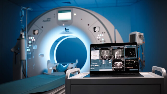 A screen displaying CT or MRI scan images against the backdrop of modern medical equipment. The concept of cutting-edge technologies and precise diagnostics in the field of medicine and healthcare.