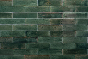 Old, green, rustic tiles wall, background, texture with copy space