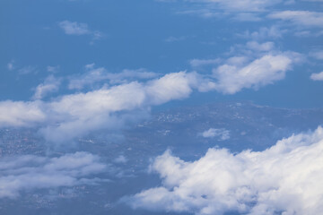 Aerial View of a Coastal City with Clouds and a River Dec 3 2024