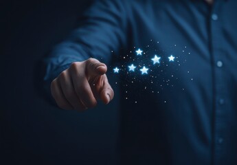 Close up view of a hand pointing towards a group of glowing, light blue stars against a dark navy blue background. The hand and clothing are in sharp