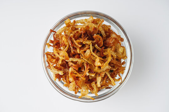 crispy golden fried onions on a white background