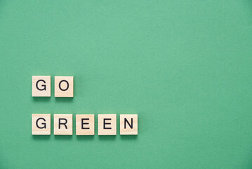 Ecology, environmental awareness message, wood pieces with letters: Go green