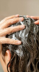 Naklejka premium Close up of woman applying shampoo and lathering hair in shower, promoting hair care and hygiene