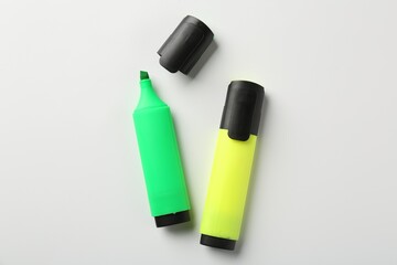 Bright highlighters on white background, flat lay