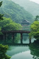 Fototapeta premium Serene Pavilion Bridge Over Calm Green Lake Amidst Lush Mountains