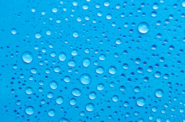 Rain water droplets with ocean blue background. Suitable for wallpaper cover design