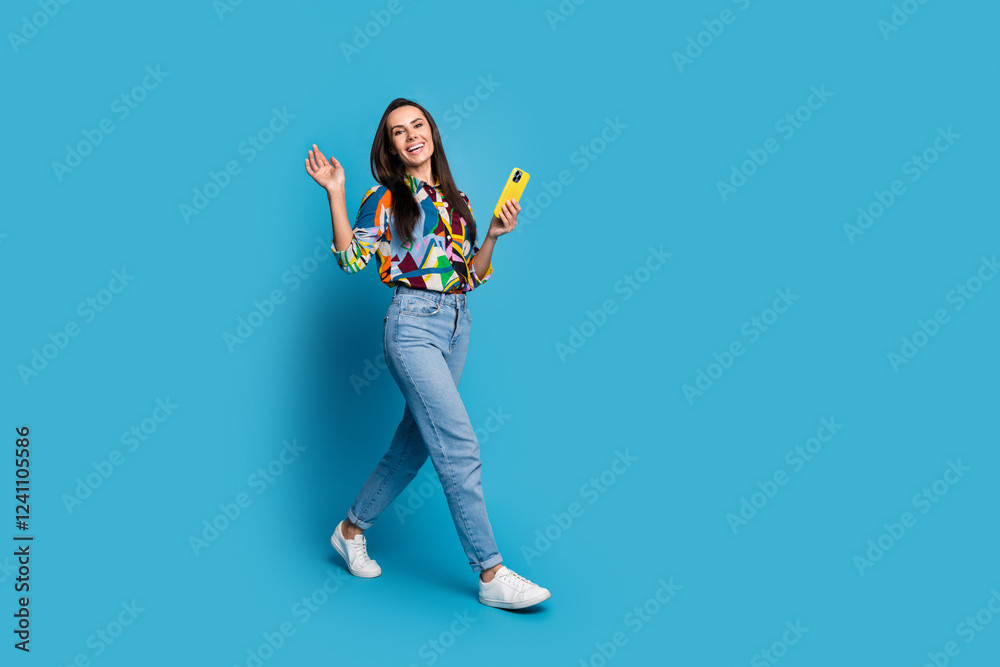 Poster full size photo of friendly cheerful girl dressed print blouse go to empty space with smartphone say