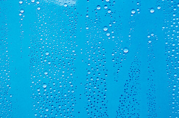 Water droplets with ocean blue background. Suitable for wallpaper cover design