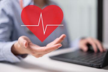 Professional healthcare medical worker holding red heart with cardiogram cardiologist concept