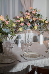 Festive table decorations, flowers and tableware, beautiful table setting for guests