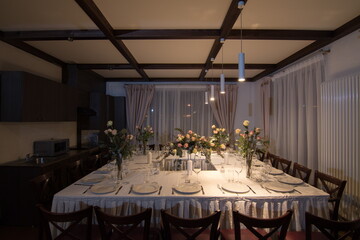 Decorative elements for festive events, home decorations. Festive table decorations, flowers and tableware