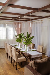 Decorative elements for festive events, home decorations. Festive table decorations, flowers and tableware
