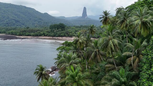 Sao Tome and Principe - Aerial View of Pico Cao Grande. Iconic Volcanic Peak Surrounded by Lush Palm Trees and Tropical Rainforest.