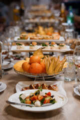 A Vibrant Array of Gourmet Dishes and Fresh Fruits on a Festive Table
