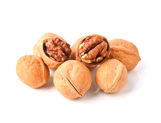 Walnuts and cracked walnut on white background