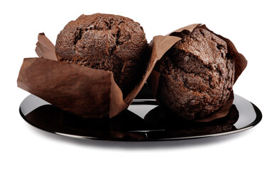 Two chocolate muffins on a black plate isolated on white background.