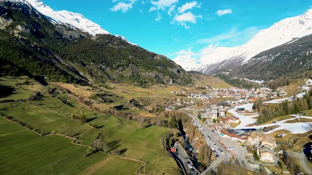 Aerial view of snowy mountains and a small village (Val Cenis, France)
