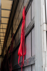 Red industrial rope straps for tightening cargo load in cargo truck. Straps for tightening for...