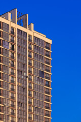 City view, modern buildings and skyscrapers against the blue sky.