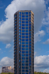 City view on a sunny day. Modern buildings, walls and windows. 