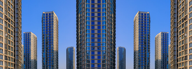 Cityscape on a summer day, modern buildings and houses 