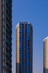 Fototapeta premium Cityscape on a summer day, modern buildings and houses 