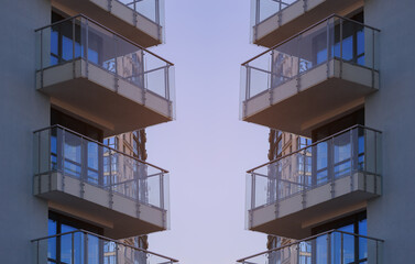 Fototapeta premium City view on a sunny day. Modern buildings, walls and windows. 