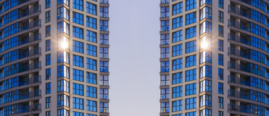 Fototapeta premium City view on a sunny day. Modern buildings, walls and windows. 