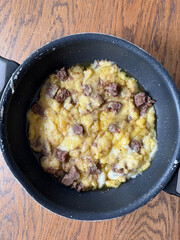 Kuymak muhlama with roasted meat kavurma in pan
