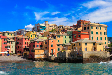 Picturesque view of beach, blue sea and colorful buildings of Boccadasse, old fishing village, in Genoa, Italy