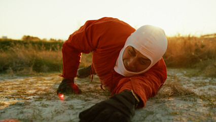 Suffocating Astronaut Crawls Lying On The Ground In Planet With Toxic Atmosphere