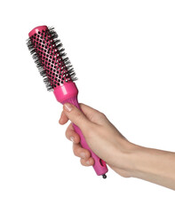 Woman with round pink hair brush on white background, closeup