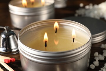 Burning soy wax candles on table, closeup