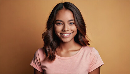Fototapeta premium Portrait of a Smiling Young Girl with Long Hair Against a Pastel Background