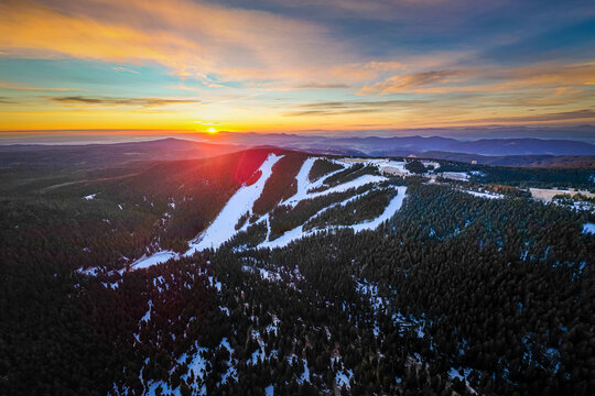 Aerial drone morning view of ski resort Rogla at sunrise dawn. Panoramic winter shot of Ski center Rogla, Slovenia