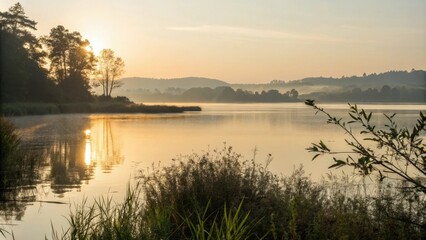 Fototapeta premium Morning sunlight dances on the surface of a serene lake, reflected light, sunlit lake, fluid motion, soft focus