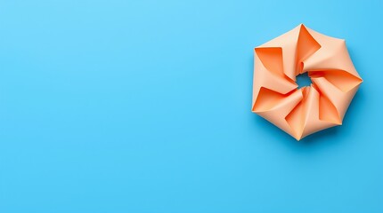 Minimalist abstract artwork with vibrant color contrast: smooth blue background, curled dual-tone paper (peach and orange), creating depth and dynamic movement.