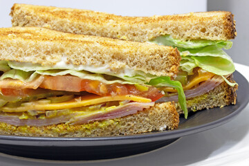 Ham and cheese dagwood sandwich extreme closeup horizontal food image