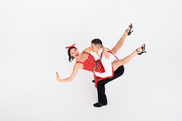 Photo of attractive cheerful professional dancers retro style dance performance isolated on white color background