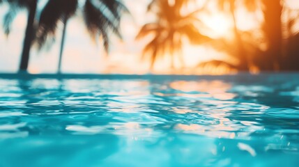 Sunset over serene water, palm trees silhouette.