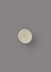 top shot on a gray background glass glass with milk children's favorite drink spiced milk from cows minimalism addition to many dishes