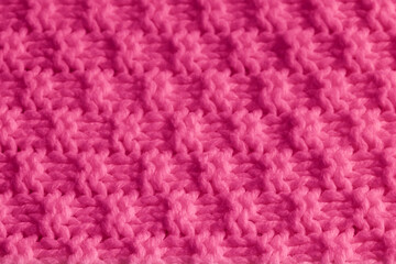 Pink textured knitted fabric background