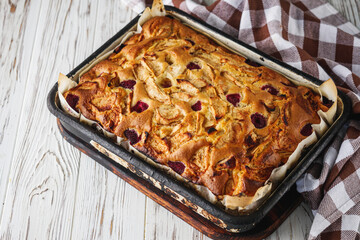 fluffy delicious freshly baked apple charlotte pie on a wooden rustic background