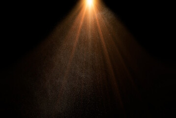 Golden light beams shining through dust particles on a black background, creating a magical and ethereal atmosphere, god rays 