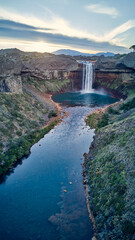 Spectacular view of Salto del Agrio waterfall – a vibrant cascade surrounded by rugged Patagonian landscapes