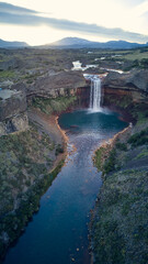 Spectacular view of Salto del Agrio waterfall – a vibrant cascade surrounded by rugged Patagonian landscapes