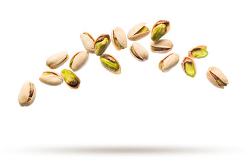 Pistachio nuts flying isolated on white background.